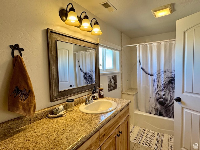 full bathroom featuring visible vents, tile patterned flooring, vanity, and shower / tub combo