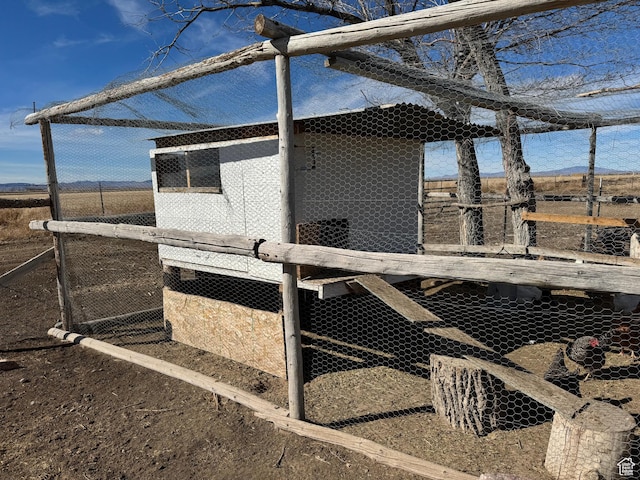 view of home's exterior featuring exterior structure and an outdoor structure