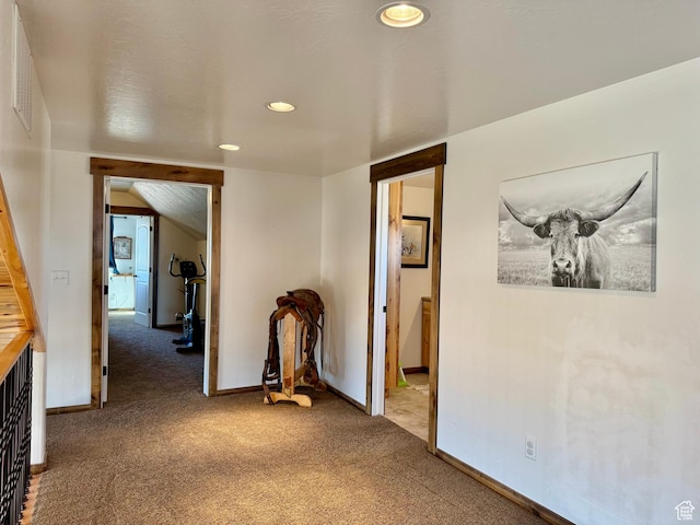 hallway featuring visible vents, baseboards, carpet flooring, and recessed lighting