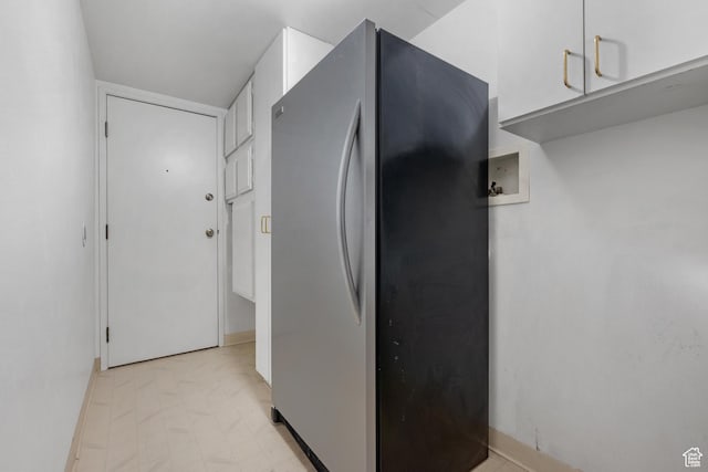 241 N Vine St W Unit 1101E, Salt Lake City, UT 84103 - kitchen with white cabinetry and stainless steel refrigerator