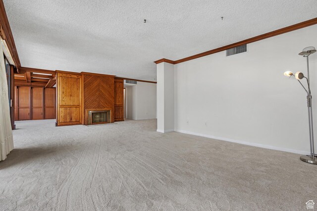 241 N Vine St W Unit 1101E, Salt Lake City, UT 84103 - unfurnished living room with ornamental molding, light carpet, and a textured ceiling