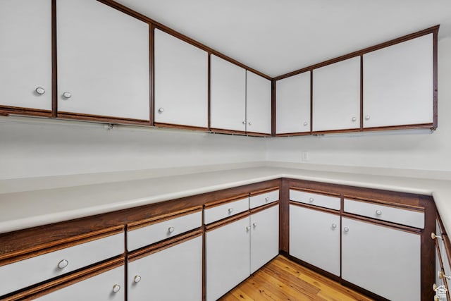241 N Vine St W Unit 1101E, Salt Lake City, UT 84103 - kitchen with white cabinetry and light wood-type flooring
