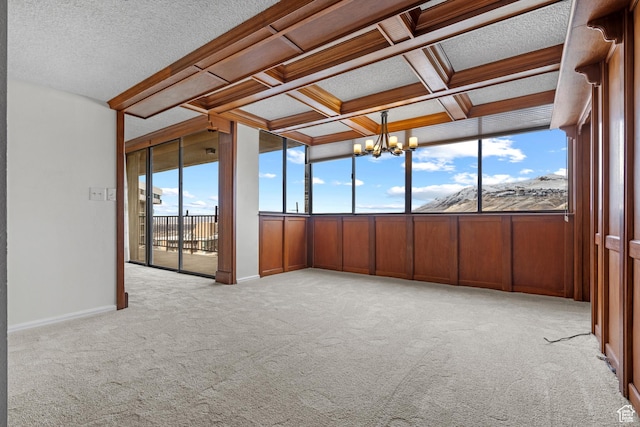241 N Vine St W Unit 1101E, Salt Lake City, UT 84103 - unfurnished sunroom featuring coffered ceiling, plenty of natural light, and an inviting chandelier