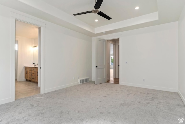 434 W 450 S Unit 815, Farmington, UT 84025 - unfurnished bedroom with carpet flooring, recessed lighting, ensuite bath, a tray ceiling, and a ceiling fan