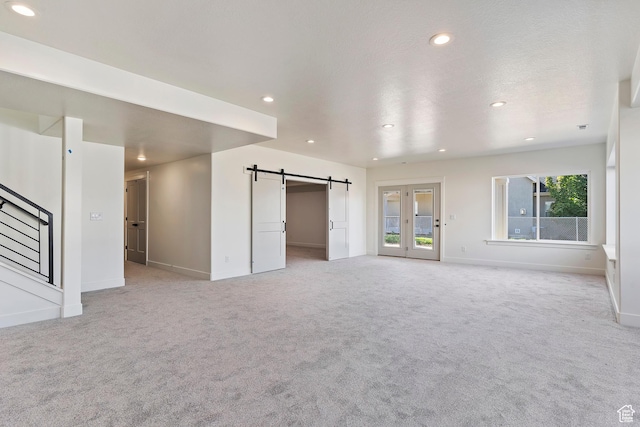 434 W 450 S Unit 815, Farmington, UT 84025 - unfurnished living room featuring light colored carpet, recessed lighting, and a barn door