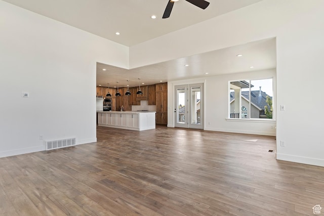 434 W 450 S Unit 815, Farmington, UT 84025 - unfurnished living room featuring recessed lighting, a ceiling fan, and wood finished floors