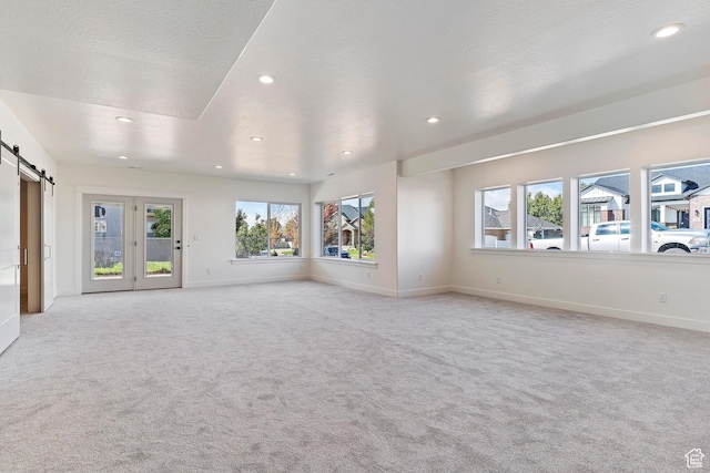 434 W 450 S Unit 815, Farmington, UT 84025 - unfurnished room featuring a barn door, recessed lighting, and light colored carpet