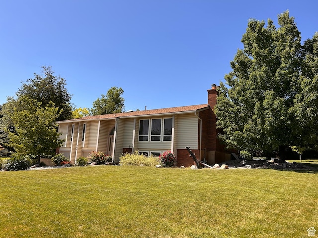 798 E 2800 N, North Ogden, UT 84414 - view of front facade with a chimney and a front lawn