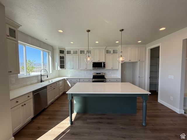 5523 N Honey Suckle Way, Eagle Mountain, UT 84005 - kitchen featuring appliances with stainless steel finishes, a sink, tasteful backsplash, recessed lighting, and dark wood-style floors