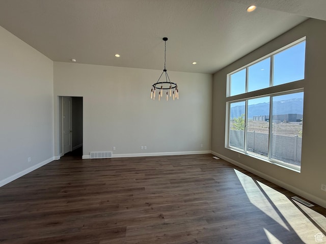 5523 N Honey Suckle Way, Eagle Mountain, UT 84005 - unfurnished room with a chandelier, baseboards, recessed lighting, and dark wood finished floors