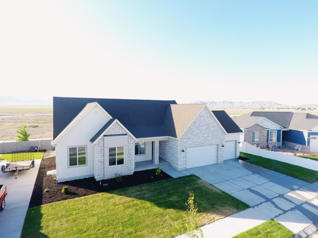 5523 N Honey Suckle Way, Eagle Mountain, UT 84005 - ranch-style house featuring a garage, driveway, stone siding, and a mountain view