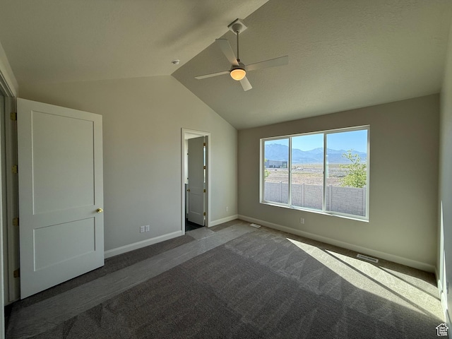 5523 N Honey Suckle Way, Eagle Mountain, UT 84005 - unfurnished bedroom with carpet, vaulted ceiling, baseboards, a mountain view, and a ceiling fan