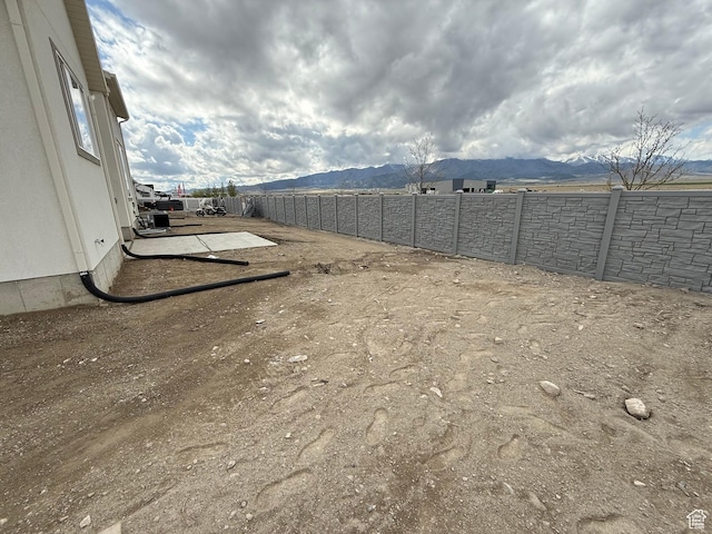 5523 N Honey Suckle Way, Eagle Mountain, UT 84005 - view of yard with a mountain view