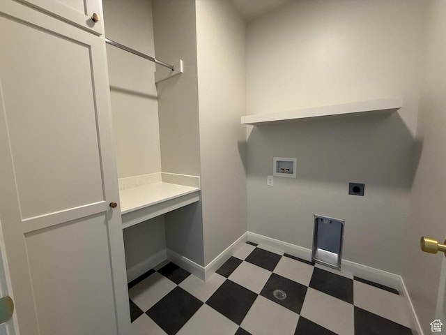 5523 N Honey Suckle Way, Eagle Mountain, UT 84005 - washroom featuring hookup for a washing machine, hookup for an electric dryer, tile patterned floors, baseboards, and a desk