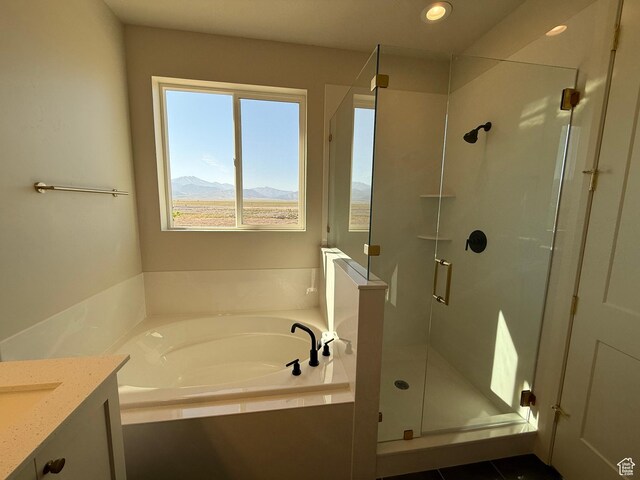 5523 N Honey Suckle Way, Eagle Mountain, UT 84005 - bathroom featuring a bath, vanity, a stall shower, a mountain view, and recessed lighting