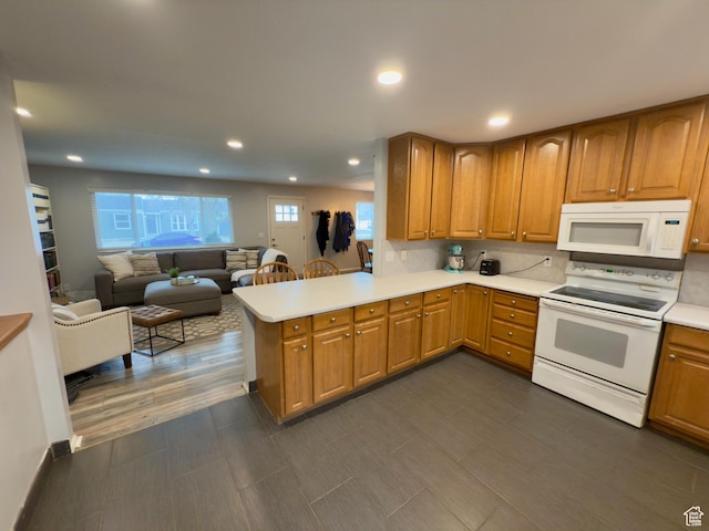 1460 E Amalfi Ave, Sandy, UT 84093 - kitchen with white appliances, a peninsula, light countertops, open floor plan, and brown cabinetry