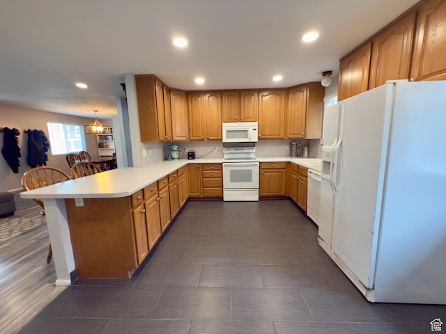 1460 E Amalfi Ave, Sandy, UT 84093 - kitchen with white appliances, a peninsula, light countertops, recessed lighting, and a breakfast bar