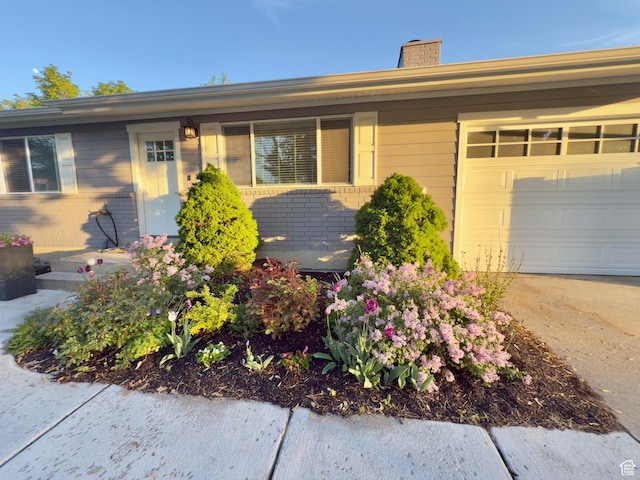1460 E Amalfi Ave, Sandy, UT 84093 - ranch-style house featuring a chimney, a garage, brick siding, and concrete driveway