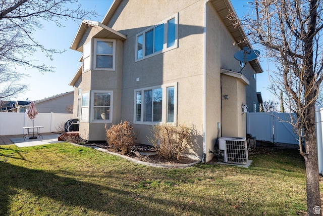 1952 E Meadow Downs Way, Cottonwood Heights, UT 84121 - back of house with stucco siding, central AC, and a patio area