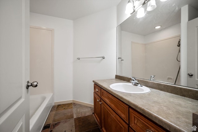 1952 E Meadow Downs Way, Cottonwood Heights, UT 84121 - full bathroom featuring vanity, baseboards, and stone finish flooring