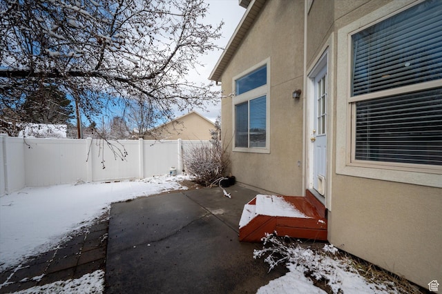 1952 E Meadow Downs Way, Cottonwood Heights, UT 84121 - snow covered patio with a fenced backyard