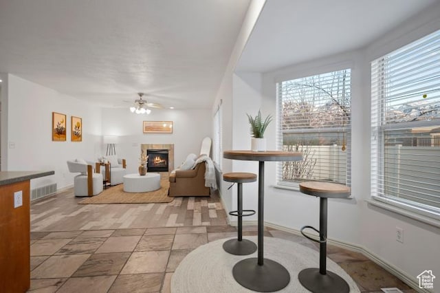 1952 E Meadow Downs Way, Cottonwood Heights, UT 84121 - living room with visible vents, a fireplace, baseboards, and a ceiling fan