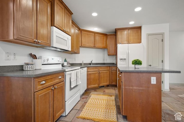 1952 E Meadow Downs Way, Cottonwood Heights, UT 84121 - kitchen featuring white appliances, a kitchen island, recessed lighting, a sink, and brown cabinets