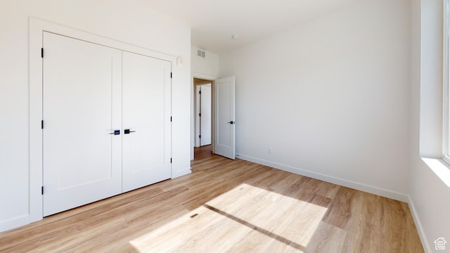 1266 S Sawmill Blvd Unit 3-303, Heber City, UT 84032 - unfurnished bedroom with light wood-type flooring and a closet