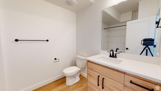 1266 S Sawmill Blvd Unit 3-303, Heber City, UT 84032 - bathroom with wood-type flooring, vanity, toilet, and walk in shower