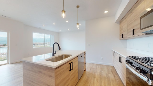 1266 S Sawmill Blvd Unit 3-303, Heber City, UT 84032 - kitchen with hanging light fixtures, stainless steel appliances, sink, and light brown cabinets