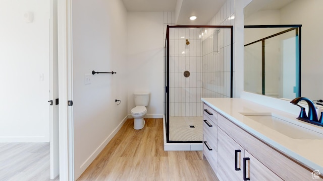 1266 S Sawmill Blvd Unit 3-303, Heber City, UT 84032 - bathroom with toilet, a shower with door, wood-type flooring, and vanity