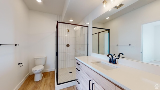 1266 S Sawmill Blvd Unit 3-303, Heber City, UT 84032 - bathroom with hardwood / wood-style floors, vanity, an enclosed shower, and toilet