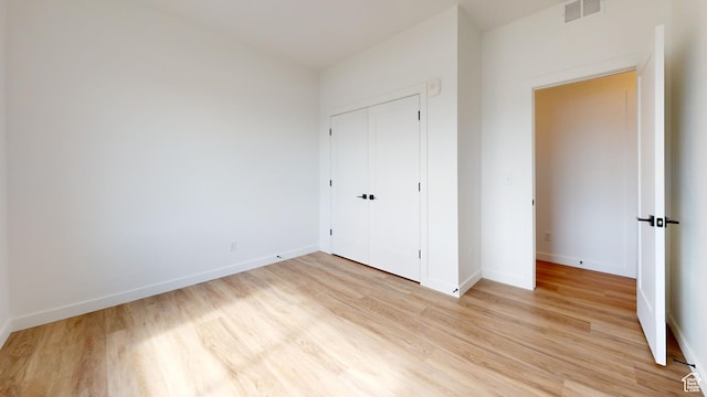 1266 S Sawmill Blvd Unit 3-303, Heber City, UT 84032 - unfurnished bedroom with light hardwood / wood-style flooring and a closet
