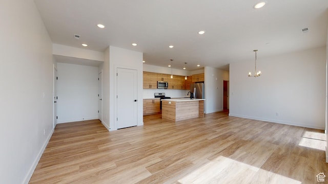 1266 S Sawmill Blvd Unit 3-303, Heber City, UT 84032 - unfurnished living room with light wood-type flooring and a notable chandelier