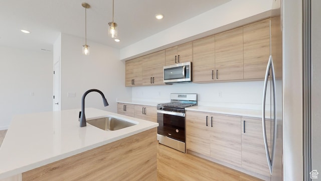 1266 S Sawmill Blvd Unit 3-303, Heber City, UT 84032 - kitchen featuring a center island with sink, hanging light fixtures, stainless steel appliances, light brown cabinets, and sink