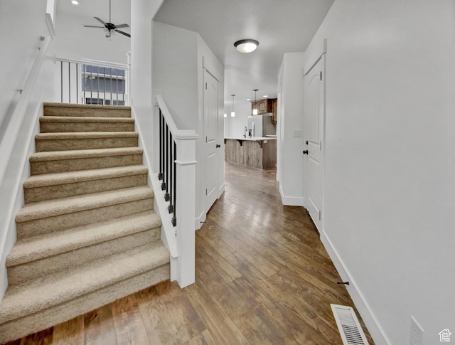 4961 W Longboat Ln, Herriman, UT 84096 - stairs with ceiling fan and wood-type flooring