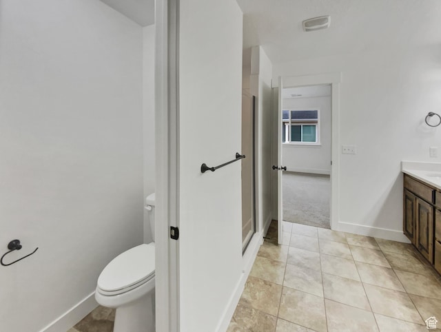 4961 W Longboat Ln, Herriman, UT 84096 - bathroom with vanity, tile patterned flooring, toilet, and a shower with door