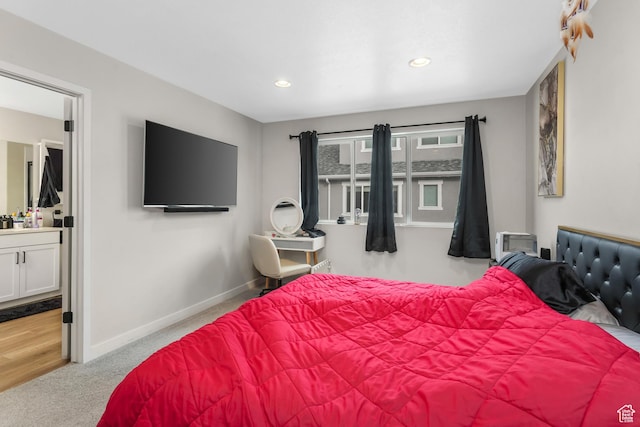 carpeted bedroom with ensuite bathroom