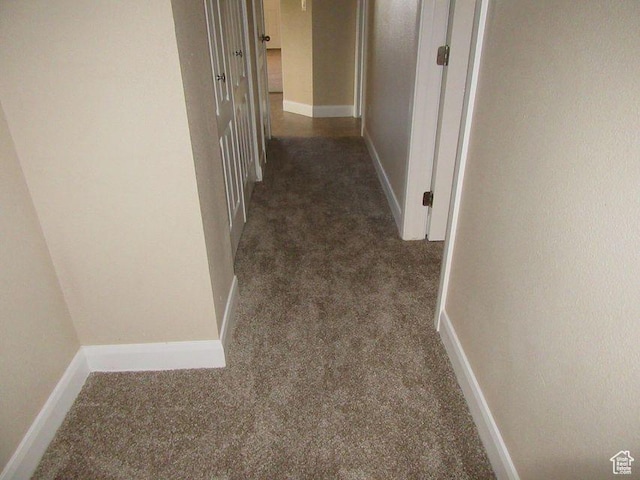 hall with dark carpet