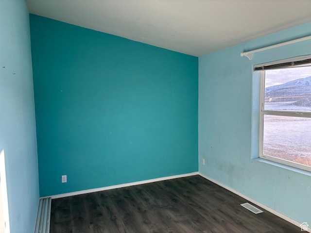 4981 N Daniels Rd, Malad City, ID 83252 - spare room with a mountain view and dark hardwood / wood-style flooring