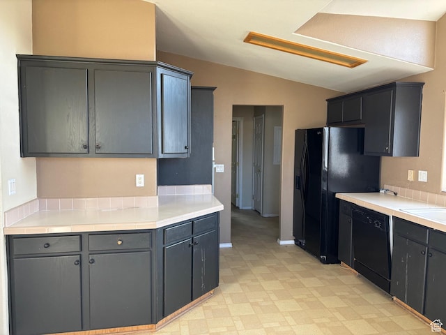 4981 N Daniels Rd, Malad City, ID 83252 - kitchen featuring vaulted ceiling, gray cabinetry, and black appliances