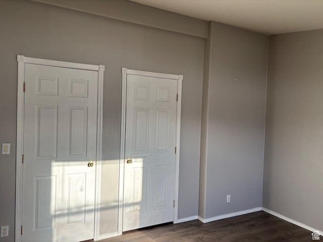 4981 N Daniels Rd, Malad City, ID 83252 - unfurnished bedroom with dark hardwood / wood-style flooring