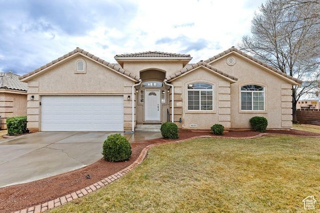 view of front of home featuring a front yard and a garage