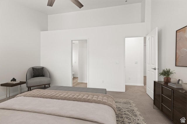 1305 E Riverside Dr Unit 1, St George, UT 84790 - bedroom featuring light colored carpet, baseboards, a ceiling fan, and ensuite bathroom