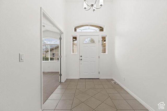 1305 E Riverside Dr Unit 1, St George, UT 84790 - foyer featuring a chandelier, light tile patterned floors, and baseboards