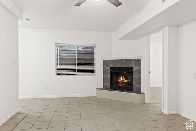 1305 E Riverside Dr Unit 1, St George, UT 84790 - unfurnished living room featuring a ceiling fan, a fireplace, light tile patterned flooring, and baseboards