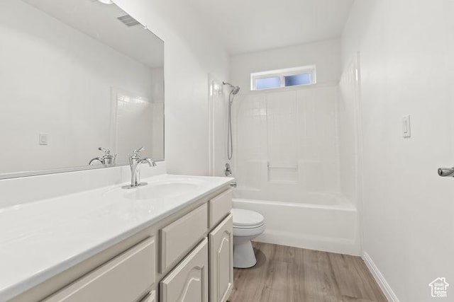 1305 E Riverside Dr Unit 1, St George, UT 84790 - bathroom featuring toilet, vanity, wood finished floors, and shower / bath combination