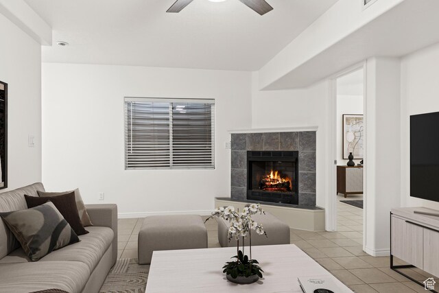1305 E Riverside Dr Unit 1, St George, UT 84790 - living area featuring light tile patterned floors, a tile fireplace, ceiling fan, and baseboards
