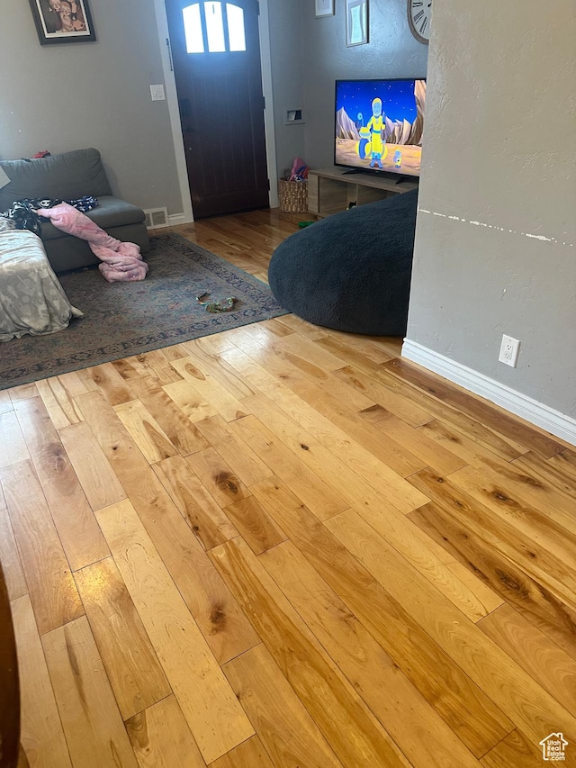 1060 E 30th S, Ogden, UT 84403 - living room with visible vents, baseboards, and hardwood / wood-style flooring