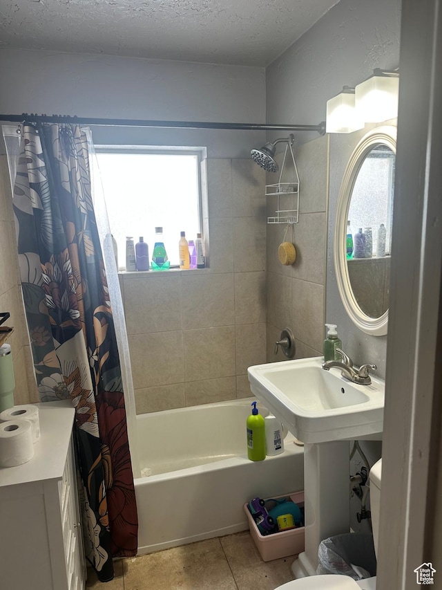 1060 E 30th S, Ogden, UT 84403 - full bathroom featuring tile patterned flooring, toilet, a textured ceiling, and shower / bathtub combination with curtain